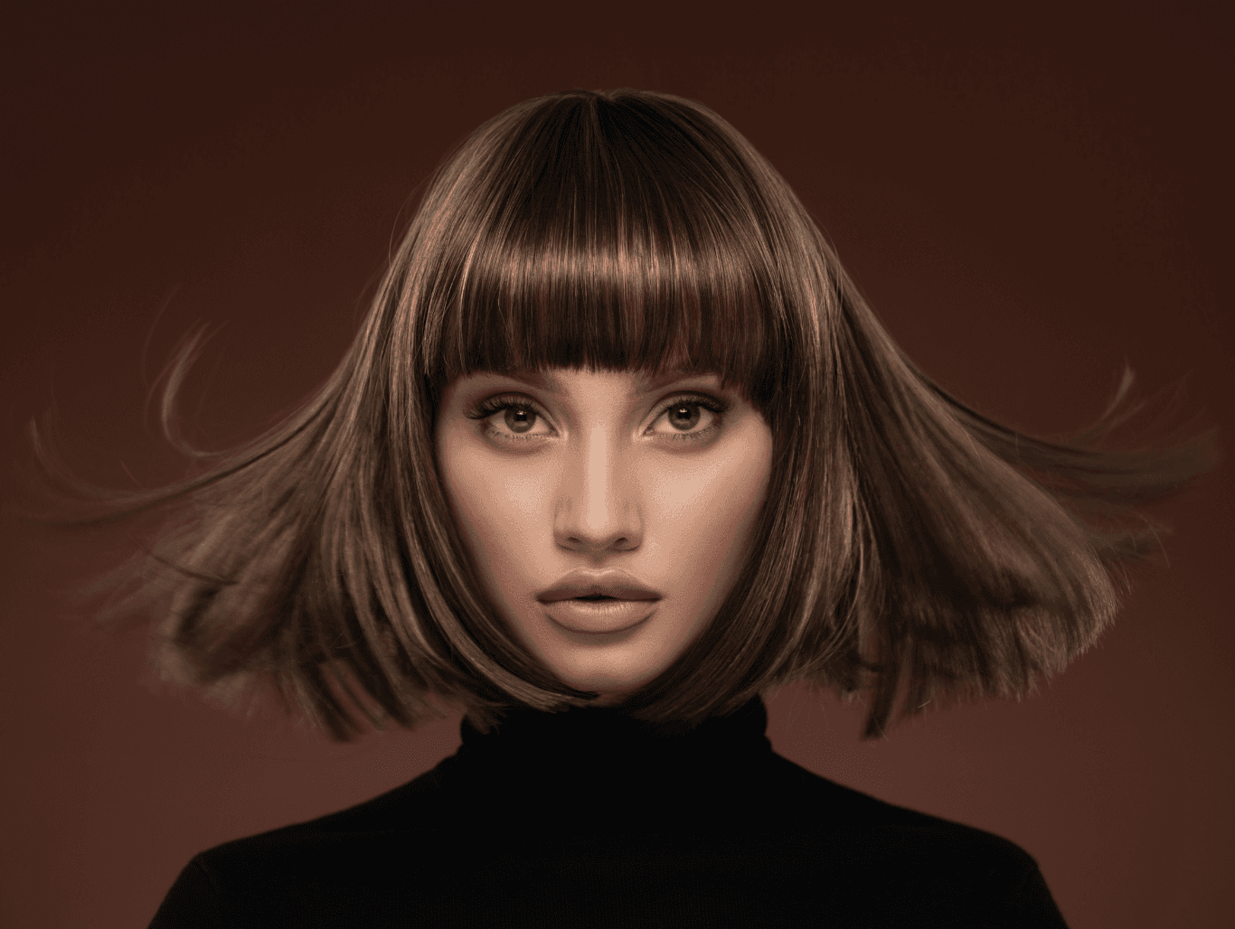 Woman with sleek, glossy brunette hair and a sharp, styled blow-dry at Baileys Hairdressing Grantham, showcasing polished shine and movement.